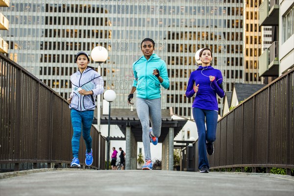 Women running in city