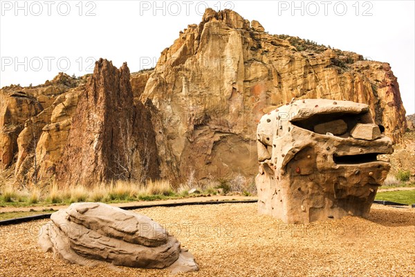 Rock formations under sheer cliffs