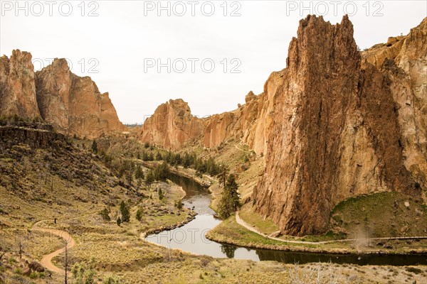Stream through sheer cliffs in desert landscape