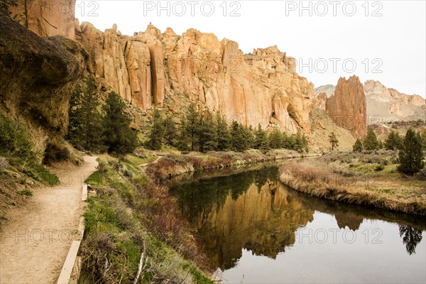 Desert cliffs reflecting in still river