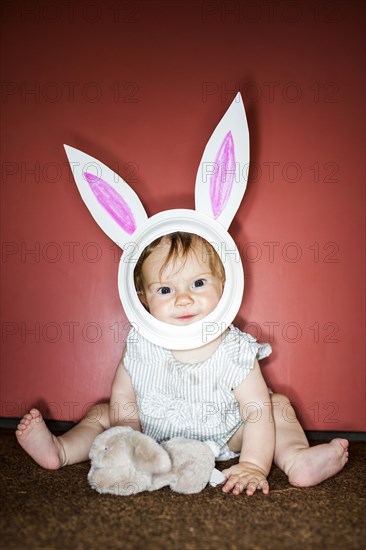 Caucasian baby girl wearing Easter Bunny costume