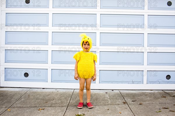 Mixed race boy wearing costume