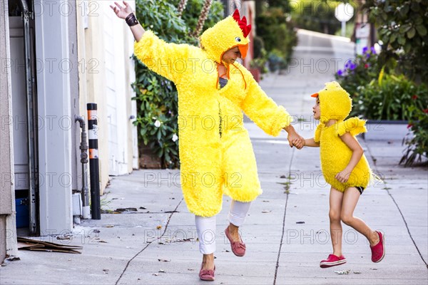 Mother and son wearing matching costumes