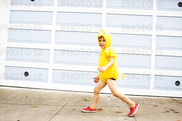 Mixed race boy wearing costume