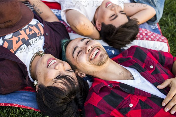 Friends laying in grass