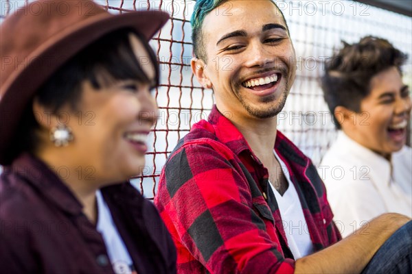 Friends laughing outdoors