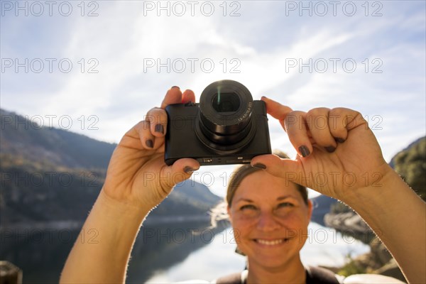 Caucasian woman photographing in Yosemite National Park