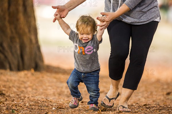 Caucasian mother and daughter walking outdoors