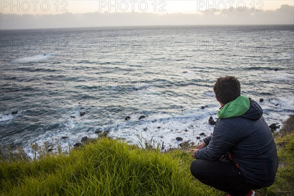 Caucasian man admiring ocean horizon