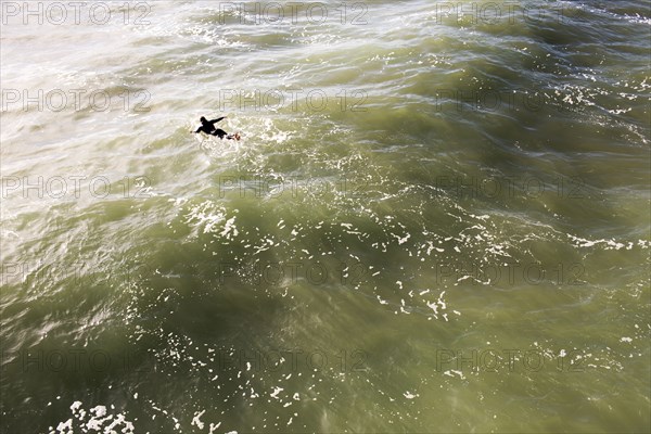 High angle view of surfer in ocean waves