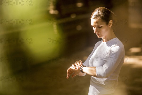 Woman checking wristwatch