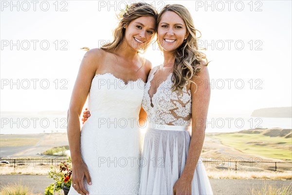 Portrait of smiling Caucasian brides