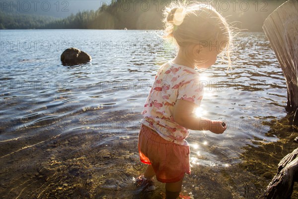 Caucasian wading in river