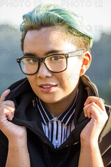 Portrait of smiling androgynous Asian woman