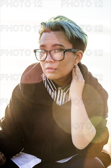 Portrait of serious androgynous Asian woman