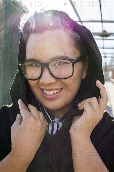 Portrait of smiling androgynous Asian woman