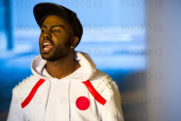 Black man yelling outdoors