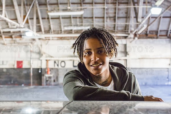 Portrait of smiling androgynous Mixed Race woman