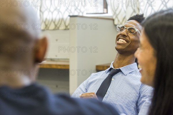 People laughing in meeting