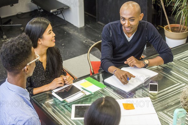 Smiling people talking in meeting