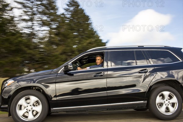 Caucasian man driving car