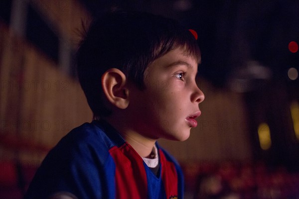 Mixed Race girl boy watching movie in theater