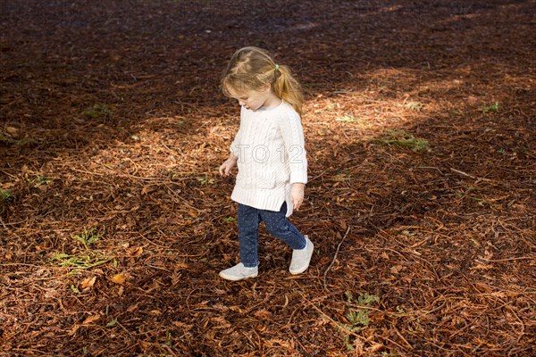 Caucasian girl walking in autumn