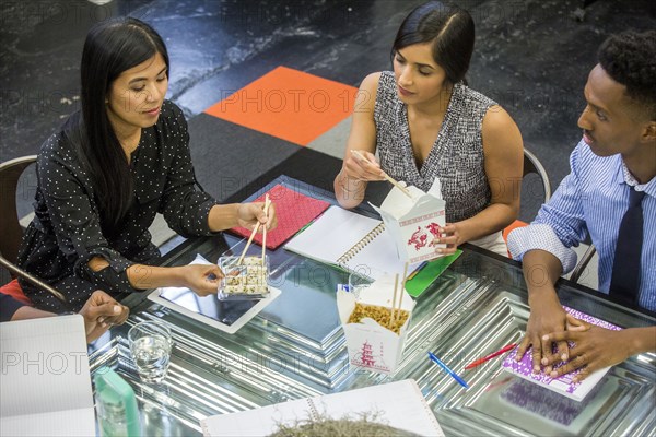 Business people eating food during meeting