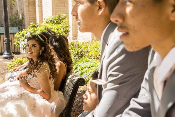 Hispanic boys and girls on bench