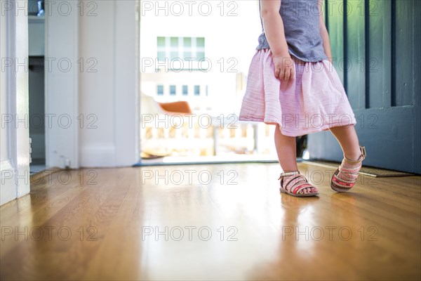 Caucasian girl wearing skirt and sandals