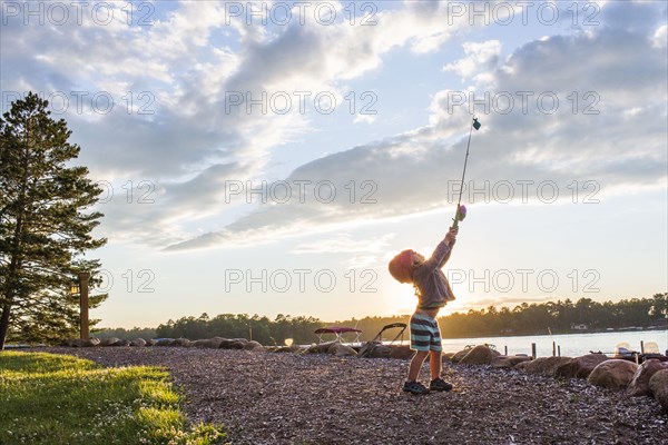 Caucasian girl holding fishing pole