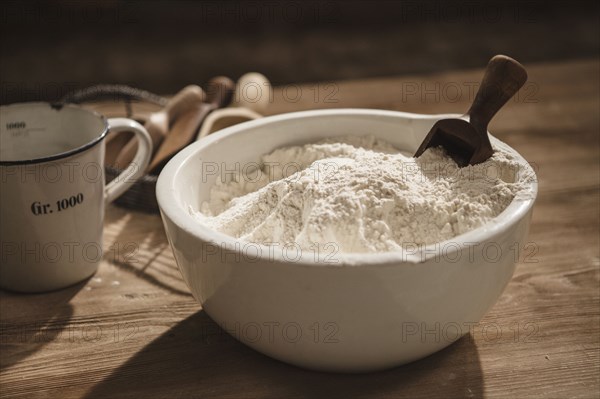 Close up of bowl of flour with scoop