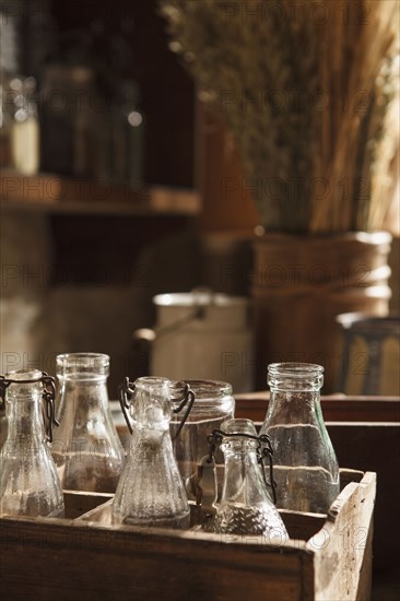 Vintage glass bottles in wooden crates