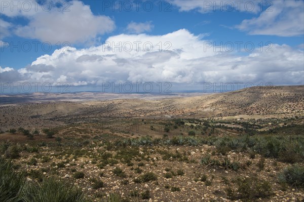 Mountains and scrubland fields in remote landscape