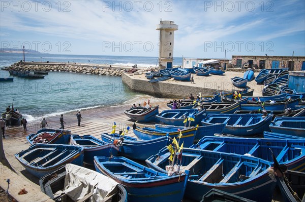 Blue boats docked on boat ramp