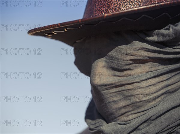 Close up of Caucasian traveler wearing face scarf