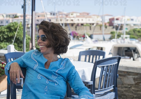 Caucasian woman sitting at outdoor cafe