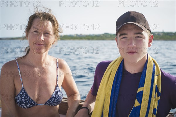 Caucasian mother and son on boat