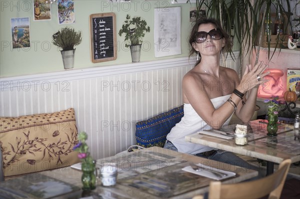 Caucasian woman sitting in cafe