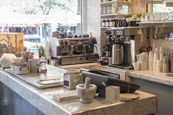 Empty counter and coffee makers in cafe