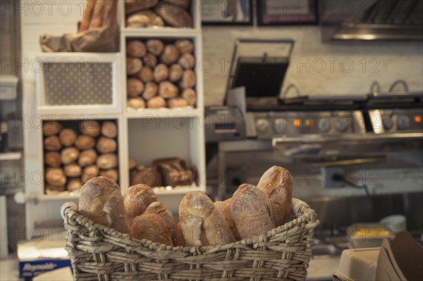 Baguettes in basket on bakery counter