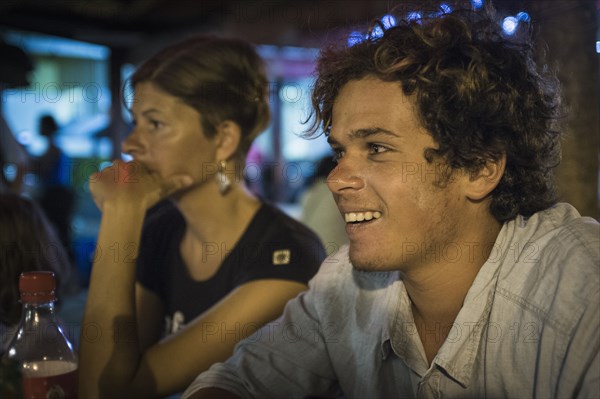 Caucasian mother and son in restaurant