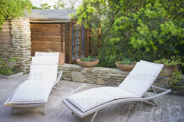 Lawn chairs on urban patio