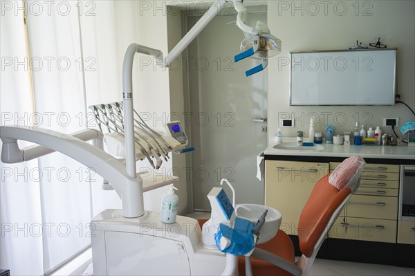 Empty chair in office of dentist