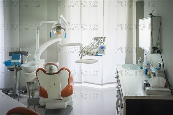 Empty chair in office of dentist