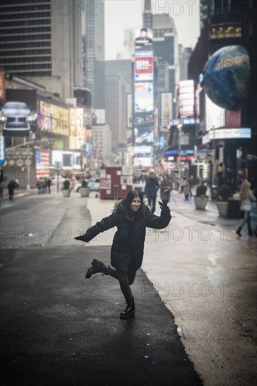 Caucasian woman posing in Times square