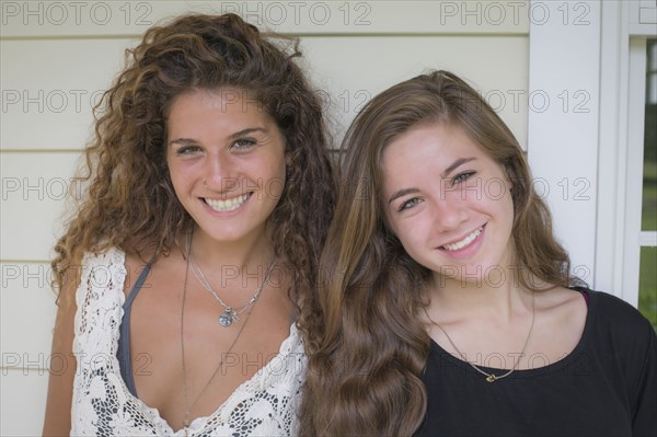 Caucasian teenage girls smiling outdoors