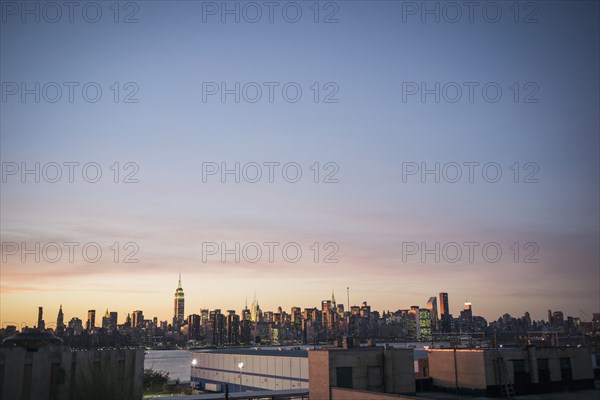 New York city skyline under sunset