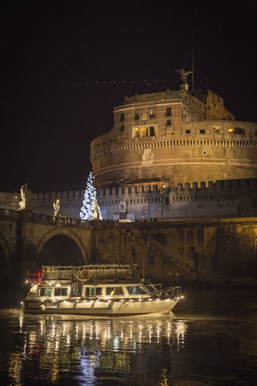 Illuminated boat floating on river