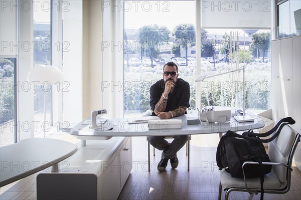 Caucasian businessman sitting in modern office